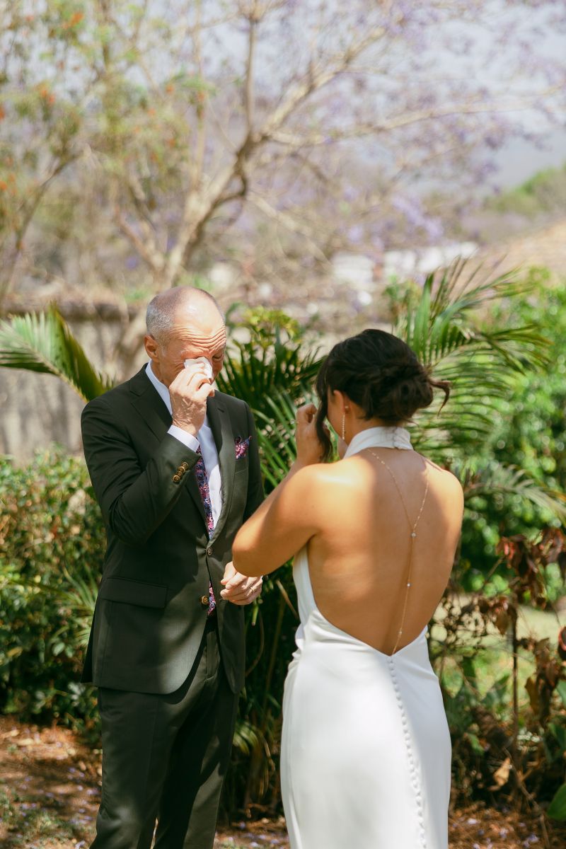 a father teary eyed sharing a first look with his daughter on her wedding day