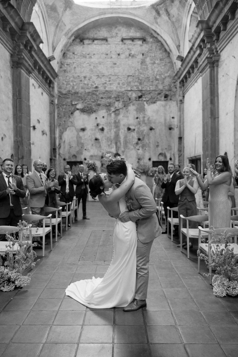 a couple kissing at their wedding ceremony in antigua guatemala at convento capuchinas
